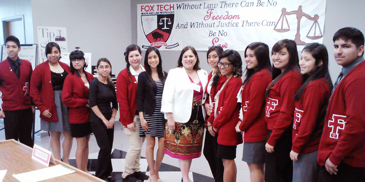Kids posing with teacher